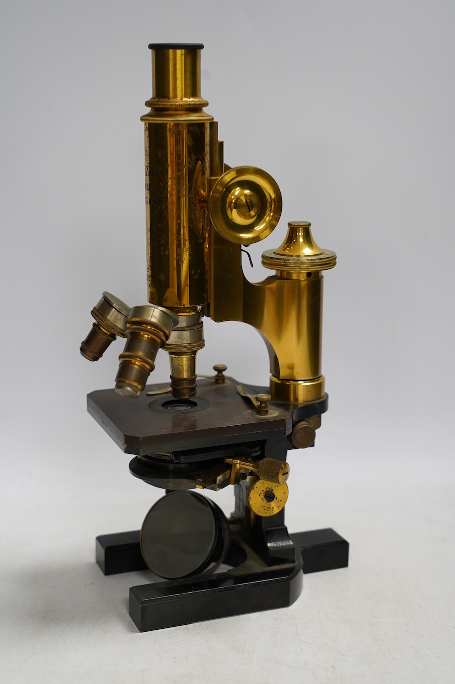 A Carl Zeiss microscope, detailed by Baker 244 High Holborn, London, in a fitted mahogany cased with alternative lenses, etc., case 38cm. Condition - fair to good